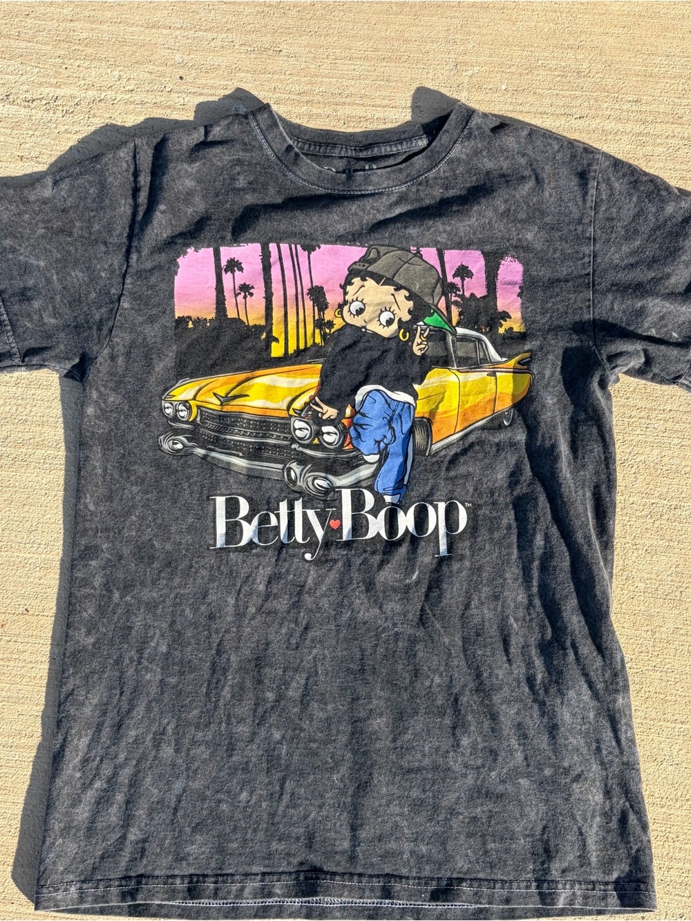 Betty Boop Black Tee with Yellow Car and Pink Sunset Graphic
